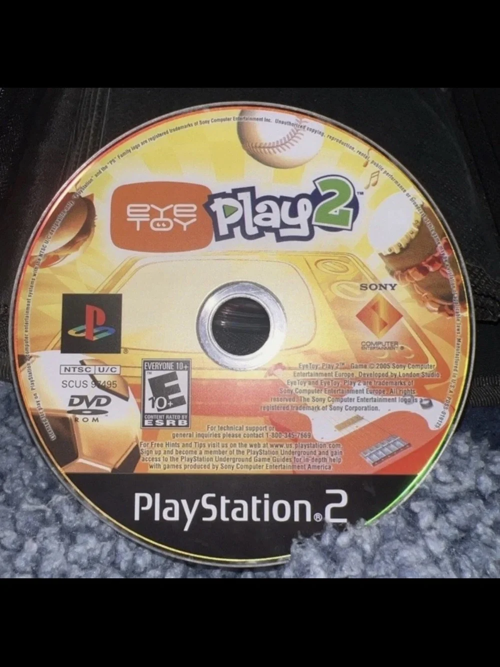 13 Disc Lot: 11 PS1 / Sony PS2 Games + 2 DVDs in Green Storage Binder Case